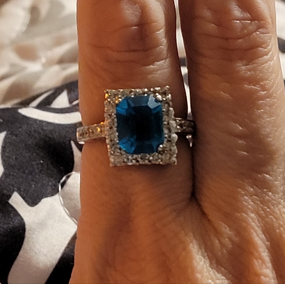 Stamped! 925 sterling silver and cz ring with a 9x11 natural blue zircon. Size 8